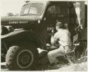 William Donnellan painting "Peabody Museum" on the door of the Dodge truck