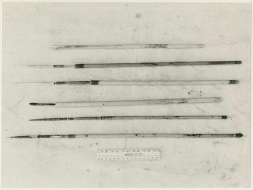 Six arrows showing various types; wood, bone, and poison tips (print is a cropped image)