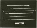 Six arrows on a black background with a ruler for measurement (print is a cropped image)