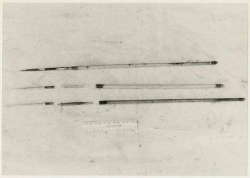 Three arrows against a white background with a ruler for measurement; shows bone point, connecting link, and shaft separated (print is a cropped image)