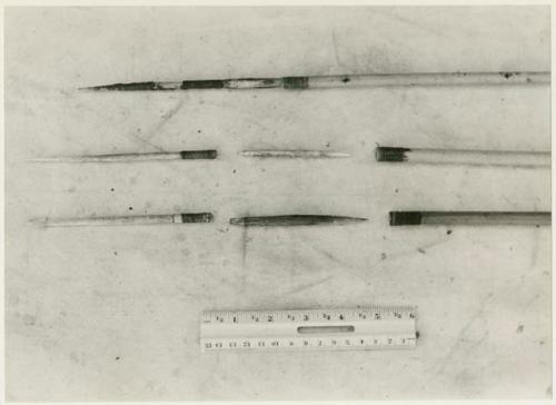 Three arrows against a white background with a ruler for measurement; shows bone point, connecting link, and shaft separated (print is a cropped image)