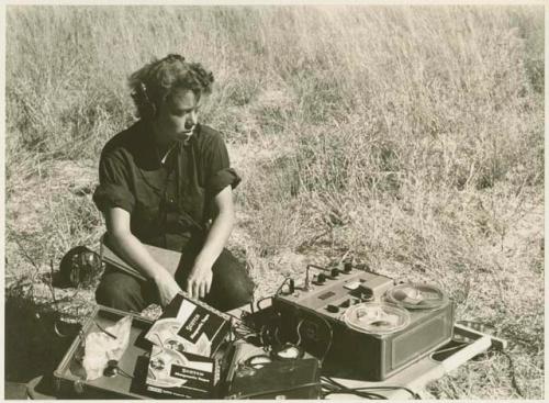 Elizabeth Marshall Thomas monitoring recording equipment (print is a cropped image)