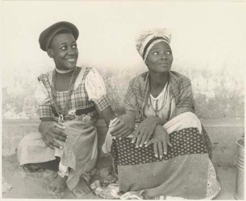 Two women sitting side by side












