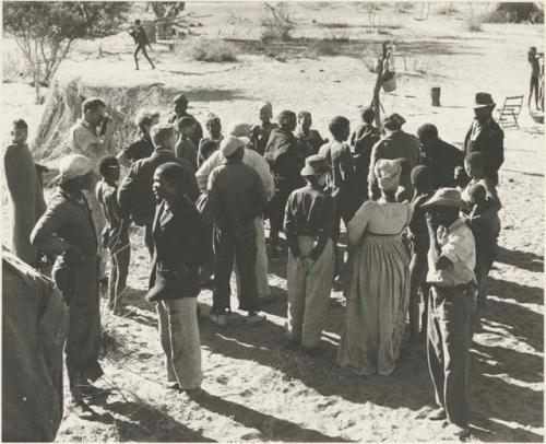 Expedition members greeted by a group of Ju/'hoansi


