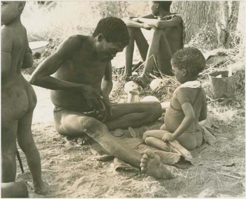 "Gao Medicine" throwing oracle disks, his son /Gaishay watching and other unidentified people

































