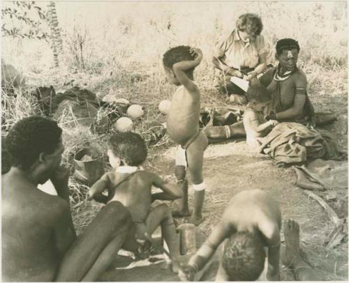 !Ungka Norna, Bau, /Gaishay (Di!ai's son), /Naoka, her son, /Gaishay, Elizabeth Marshall Thomas taking notes, and other unidentified people





























