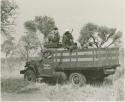 Power wagon with Elizabeth Marshall Thomas on top and a group of Ju/'hoansi and expedition members in the back
































