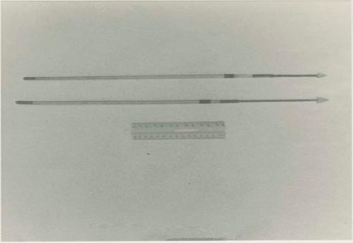 Two arrows and ruler for measurement
































