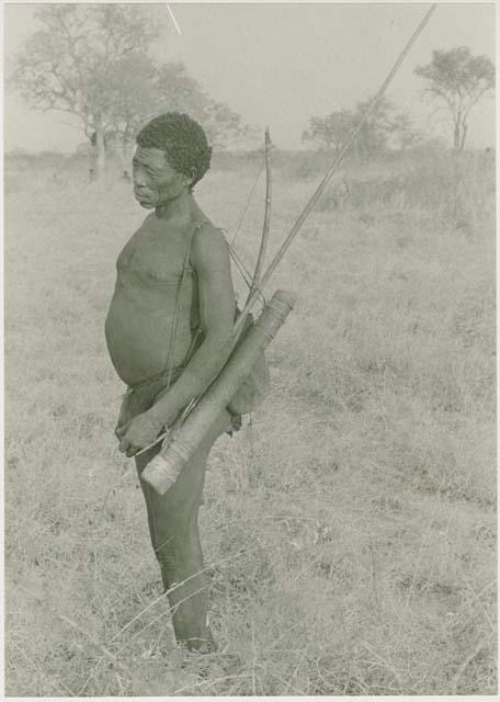 "Old Gau" with a quiver, bow, and spear hanging over his left shoulder








































