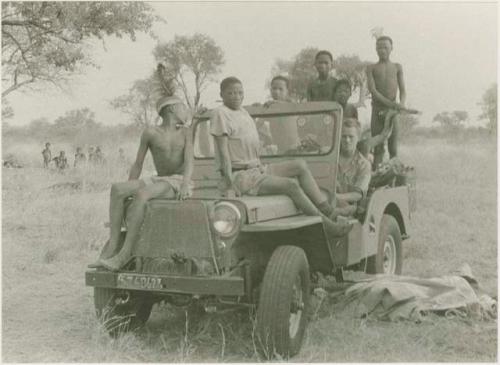 John Marshall and unidentified Ju/'hoansi in a Jeep







































