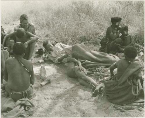 Group of people including "/Qui Hunter" lying down, ≠Toma, and John Marshall
















































