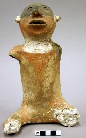 Seated pottery effigy.