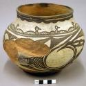 Jar, polacca polychrome style c. zuni rain bird design. 16.4 x 21.3 cm.