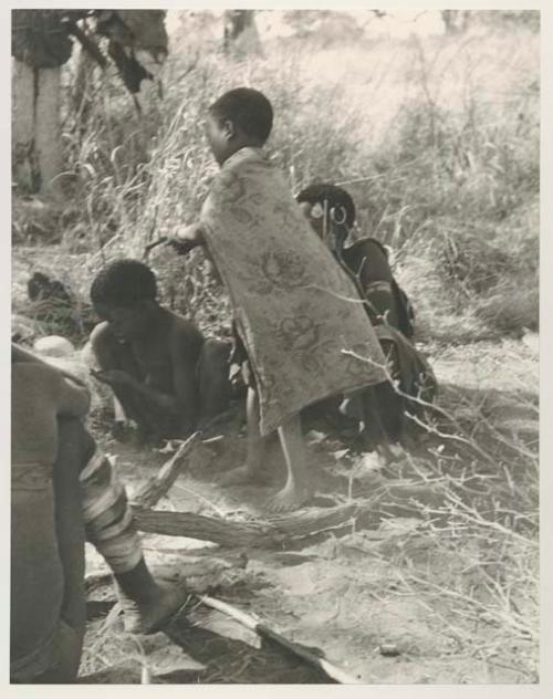 "Little ≠Gao" in his scarf and other unidentified people, seated