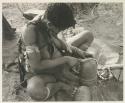 Woman trimming the edge of a leather headband with a knife



























