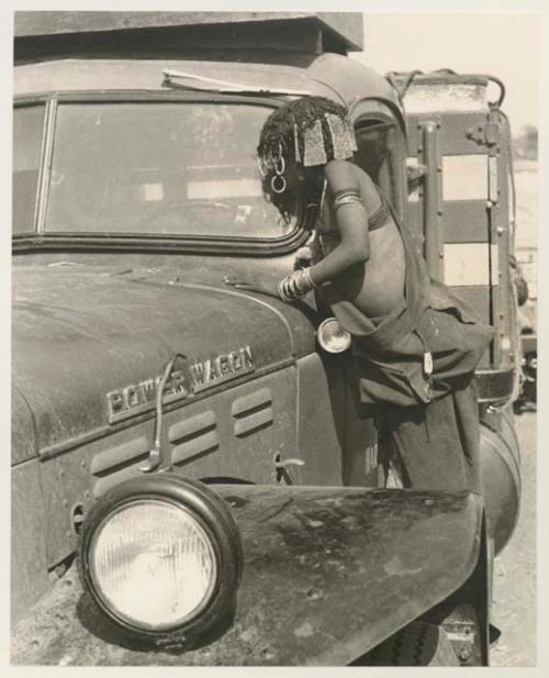 N!ai looking through the windshield of an expedition truck
























