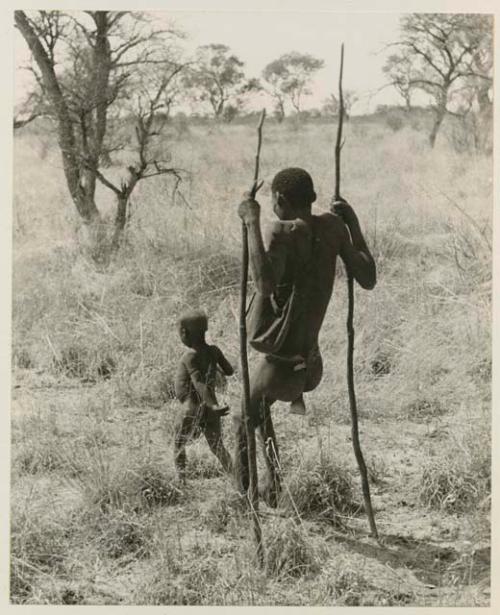 !Kham using sticks as crutches and walking with his son

























