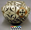 Large pottery vessel - black and white geometric design; 11.5 in. high.