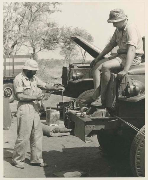 Casper Kruger sitting on hood of GMC truck, with Robert Story standing
























