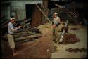 Fishermen repairing nets