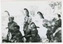 [No folder title]: Group of six people standing together with feathers in their hair (print is a cropped image)