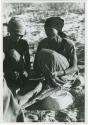 [No folder title]: Group of women playing the dandiri, close-up view (print is a cropped image)