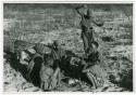 [No folder title]: Group of women playing the dandiri; Dadum dancing (print is a cropped image)