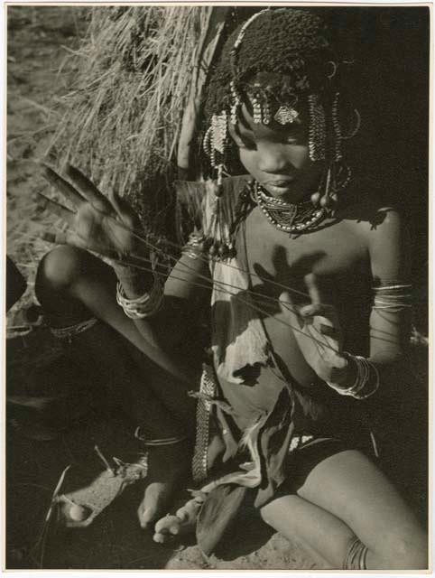 "Cats cradle": Girl holding a "cat's cradle" (print is a cropped image)