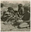 "Music": /Gishay (Gau's son) playing the //guashi and sitting with "Little N!ai" and //Khuga (print is a cropped image)