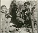 "Sewing": Khwo//o-/Gasa and /Naoka ("Gao Medicine's" wife) sitting in front of a skerm, close-up (print is a cropped image)