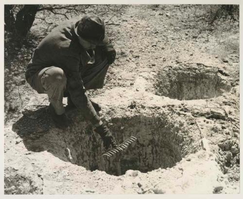 Casper Kruger showing the depth of a pit near the Herero Reservation