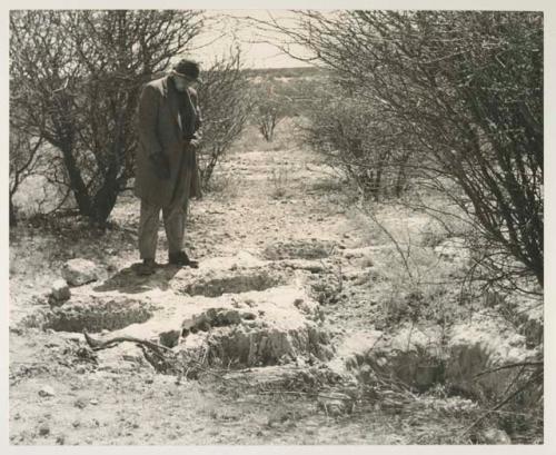 Casper Kruger showing the depth of a pit near the Herero Reservation