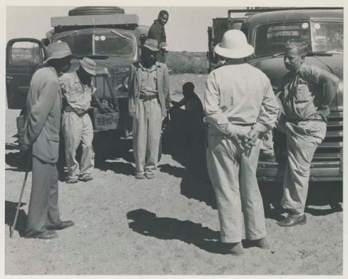 Group of people standing with Theunis Berger and Laurence Marshall