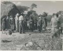 Group of people talking with L. F. Maingard