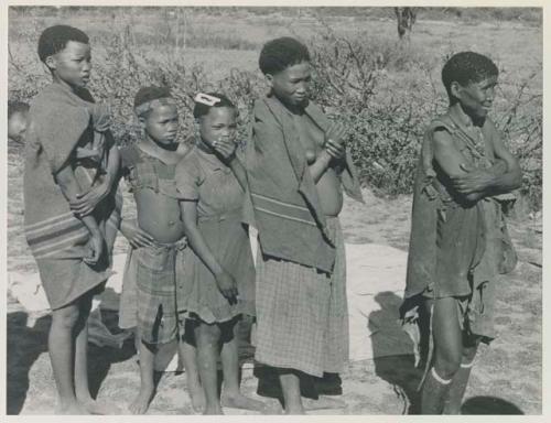 Group of people talking with L. F. Maingard, with Laurence Marshall photographing