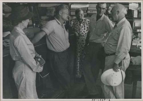 Group of people in conversation, including Lorna Marshall, Laurence Marshall and Theunis Berger