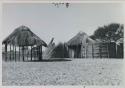 Huts and fence in village

