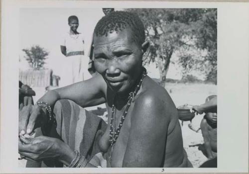 Woman sitting, close-up

