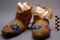 Woman's light moccasins. Made of buckskin. Outside seam. Very narrow tongue