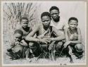 "1952-53, G23-G27": "/Qui Guide" sitting with his wife Di!ai and //Ao's three children, /Qui, Di//khao and !Ungka (who was engaged to /Gunda, son of "Old ≠Toma" and /Gam) (print is a cropped image)