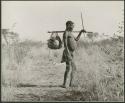"Water": Man carrying an assegai and a net full of ostrich egg shells hung on his carrying stick (print is a cropped image)