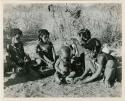 "Little N!ai" (left) and three unidentified girls sitting with !Ungka Norna (center)