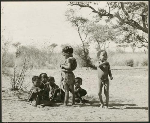 [No folder title]: Group of children sitting and standing (print is a cropped image)