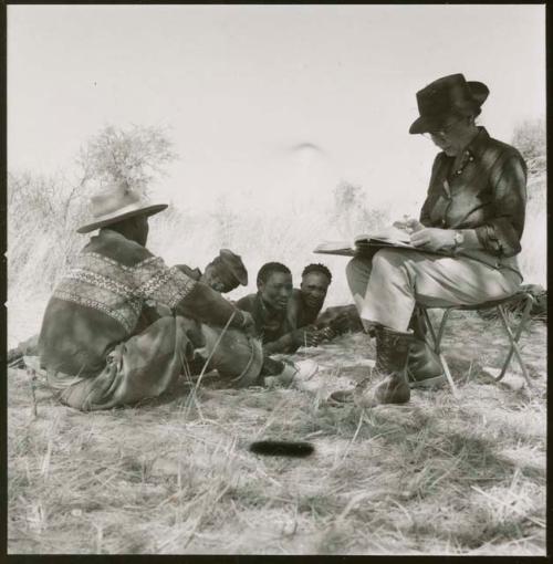 "/Qui Hunter," /Qui (brother of "Gao Helmet") and another man being interviewed by Kernel Ledimo and Lorna Marshall