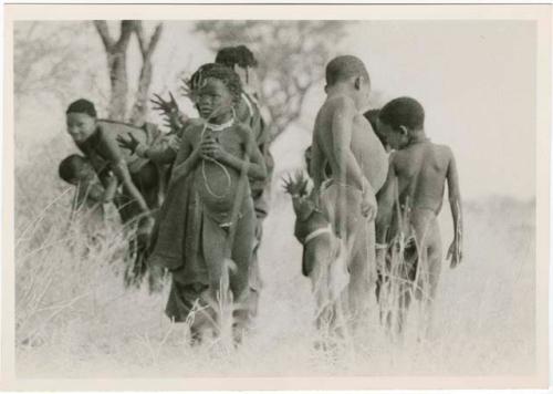 "Boys and girls playing together": Boys dancing and girls clapping (print is a cropped image)