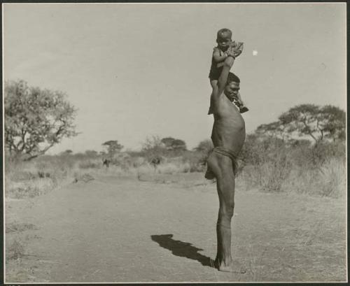 "Fathers carrying children": "Gao Medicine" lifting /Gaishay up to his shoulder (print is a cropped image)