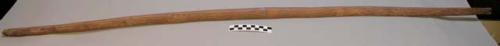 Wood bow, probably from the Plains. Covered w/ red pigment. Not strung.