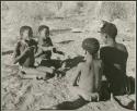 "Porcupine or Axe and Assegai [game]": Boys playing !ó'm!hú / !’Om g!xuni / ’Ai kota !U!u g!xuni / N!aih //’an (the porcupine game, also known as the axe game, assegai game or war game), including Gao (son of ≠Gao and Khwo//o-/Gasa of Band 4) and /Gishay (son of "Old Gau," Band 1) (print is a cropped image)