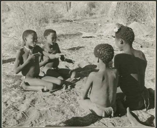 "Porcupine or Axe and Assegai [game]": Boys playing !ó'm!hú / !’Om g!xuni / ’Ai kota !U!u g!xuni / N!aih //’an (the porcupine game, also known as the axe game, assegai game or war game), including Gao (son of ≠Gao and Khwo//o-/Gasa of Band 4) and /Gishay (son of "Old Gau," Band 1) (print is a cropped image)