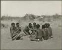 "Porcupine or Axe and Assegai [game]": Men and boys playing !ó'm!hú / !’Om g!xuni / ’Ai kota !U!u g!xuni / N!aih //’an (the porcupine game, also known as the axe game, assegai game or war game) (print is a cropped image)